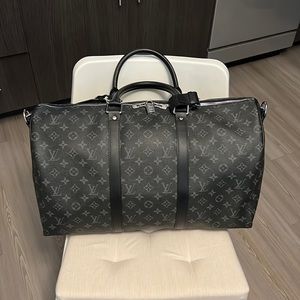 Grey and black Louis Vuitton keepall bag